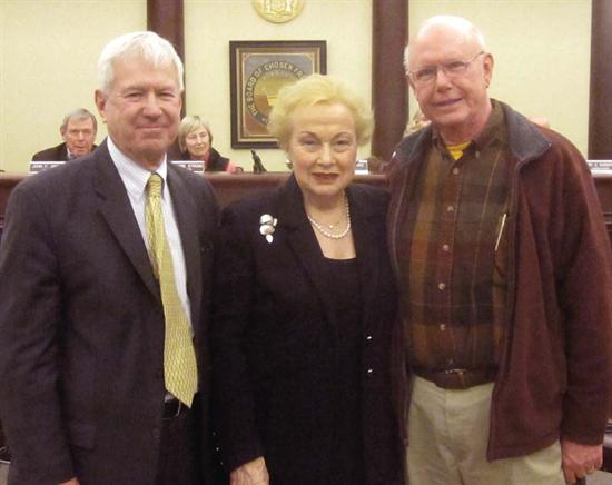 Monmouth County Historical Commission Chairman Brooks Von Arx and Freeholder Lillian G. Burry present Gordon Clark of the Shrewsbury Friends a historic preservation matching fund grant.